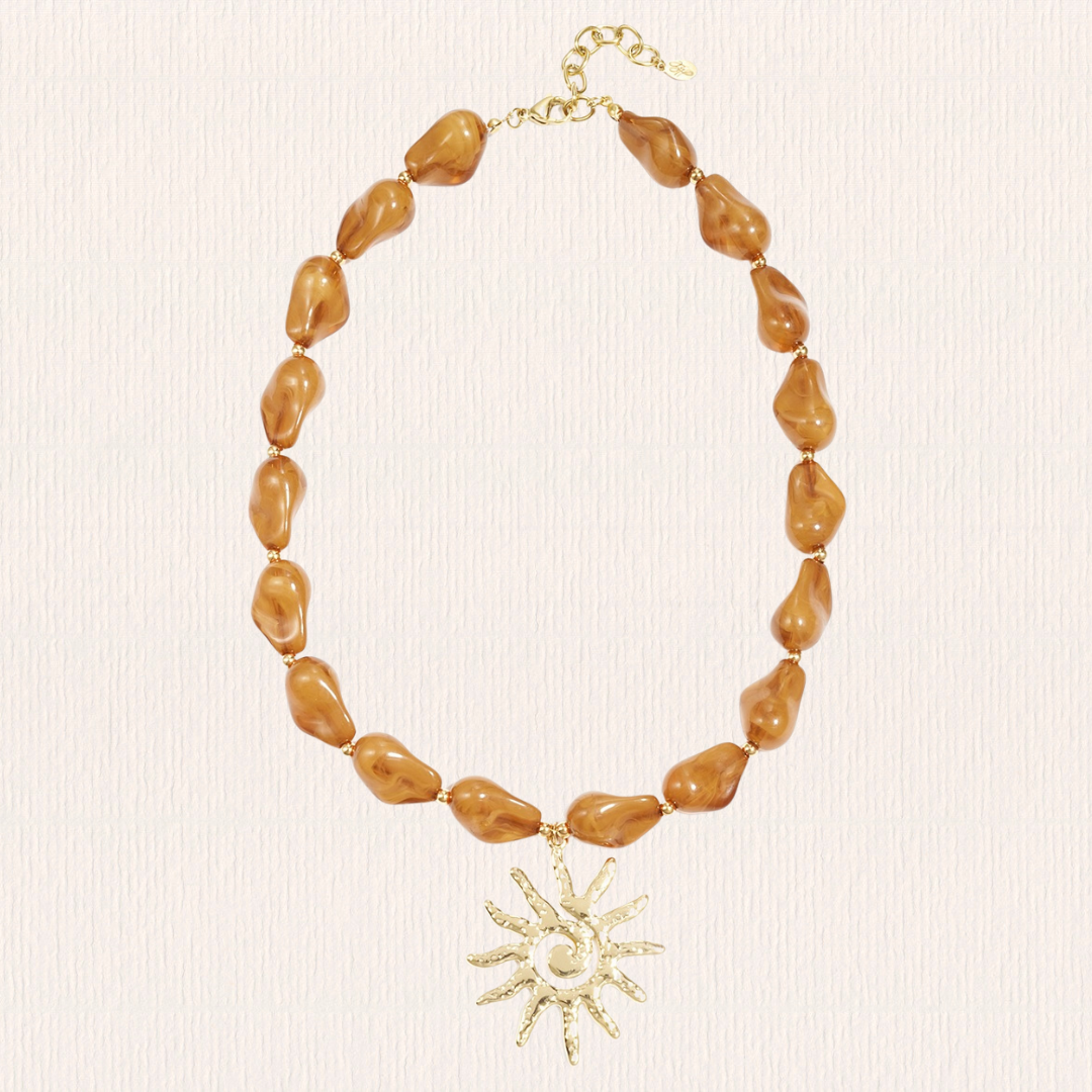 Bruine kralenketting met zon bedel