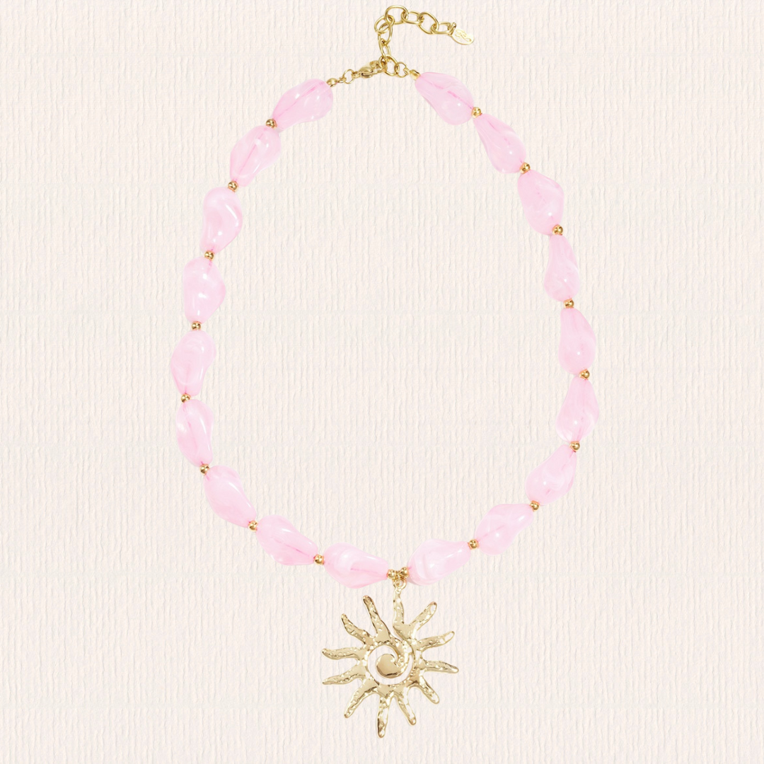 Roze kralenketting met zon bedel