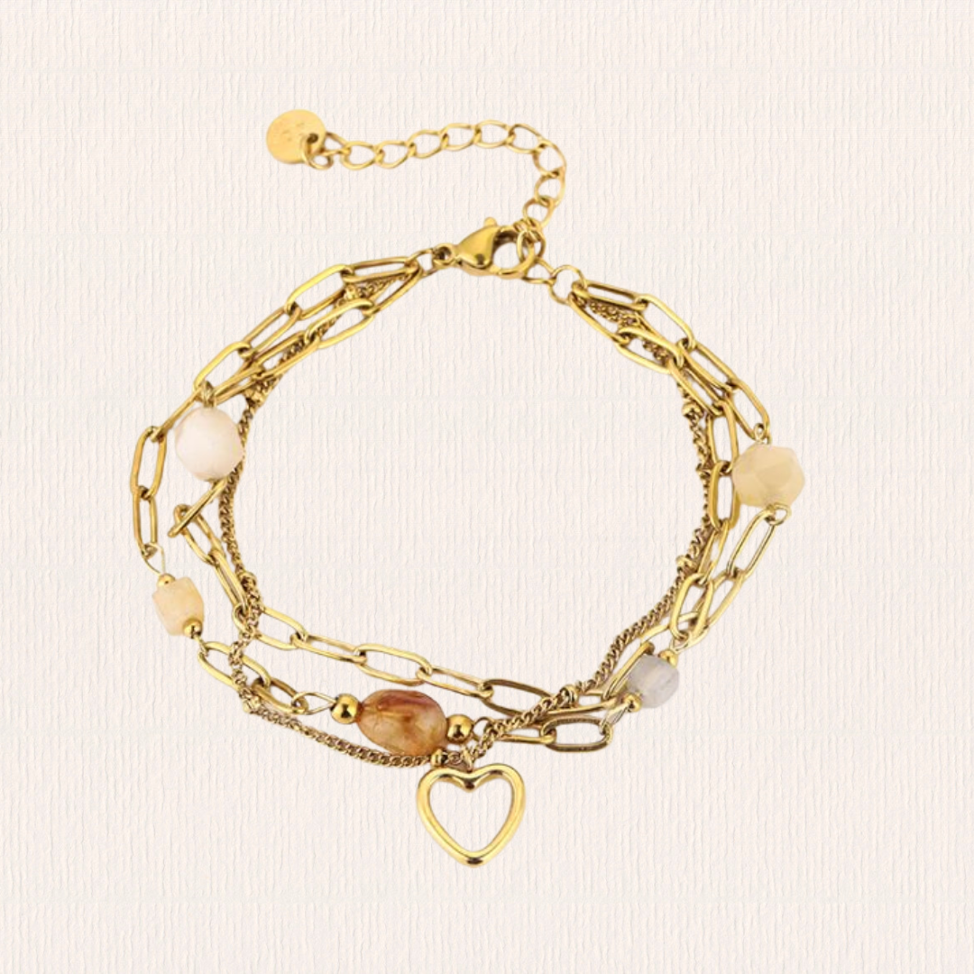Dubbele armband met stenen en hartje geel