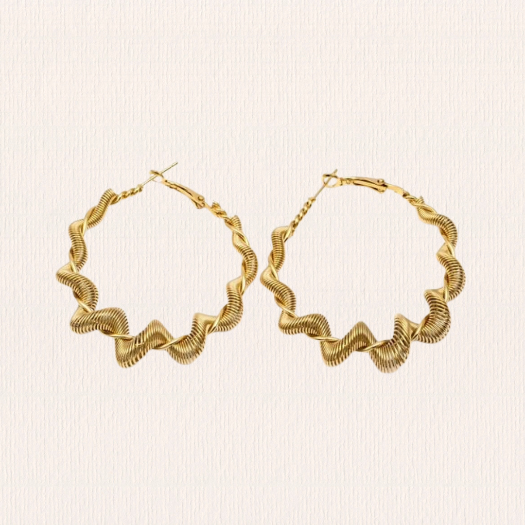 Gouden oorbellen swirl