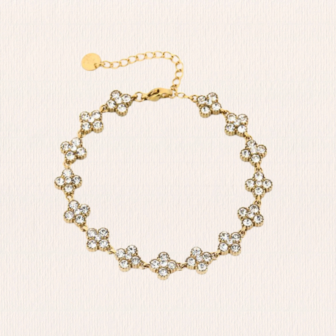 Gouden met witte klaverarmband