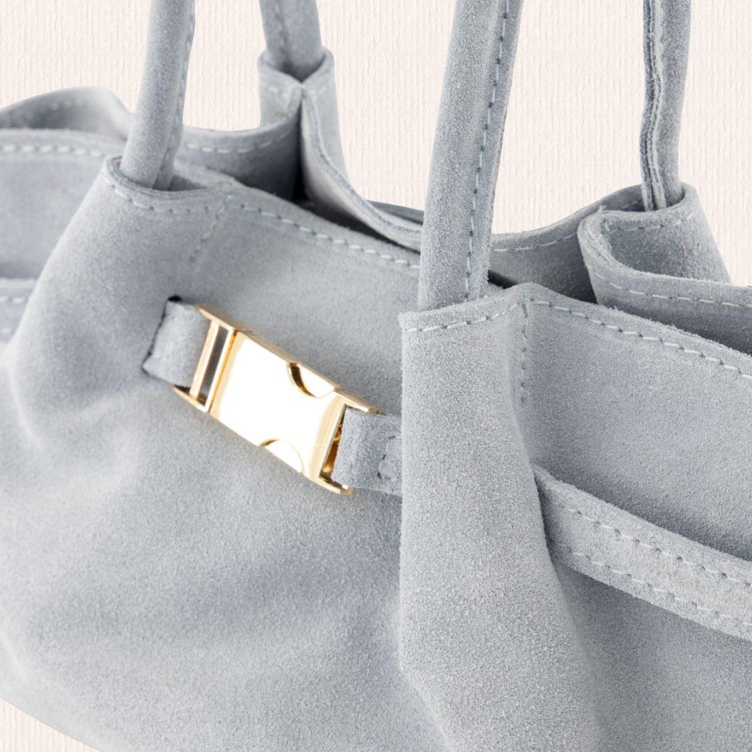 Lichtblauw handtasje met goud detail