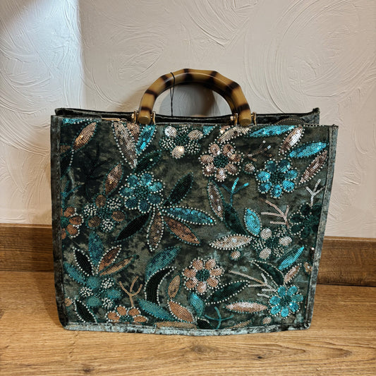 Groene tas met glitter borduursel
