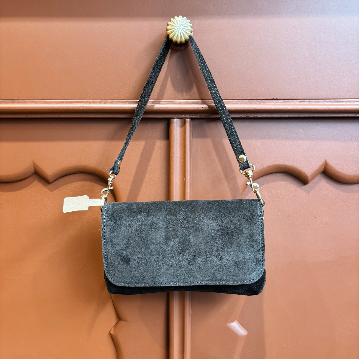 Donkerbruine suede clutch