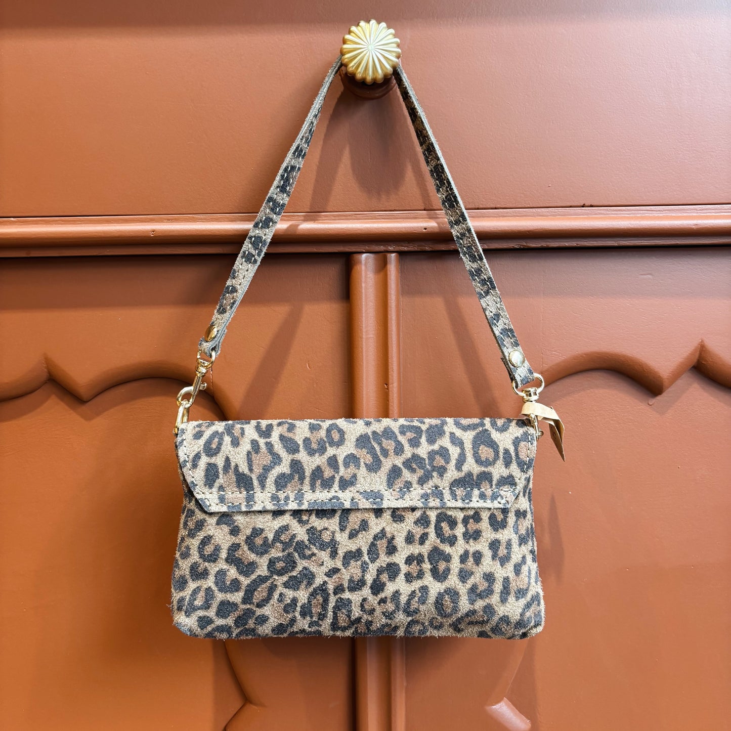 Panterprint suede clutch