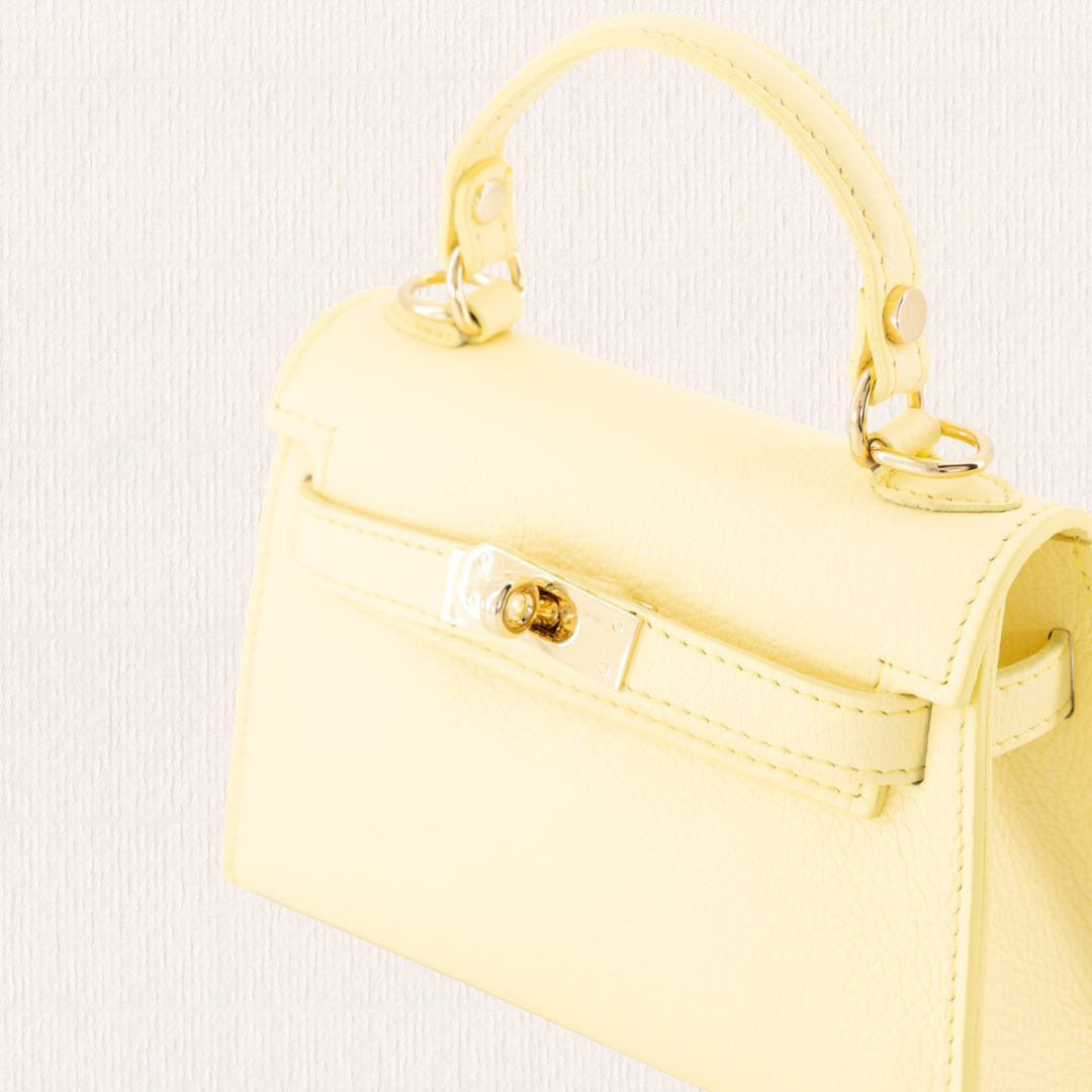 Leren handtas met gouden slotje butteryellow