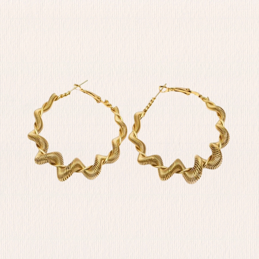 Gouden oorbellen swirl