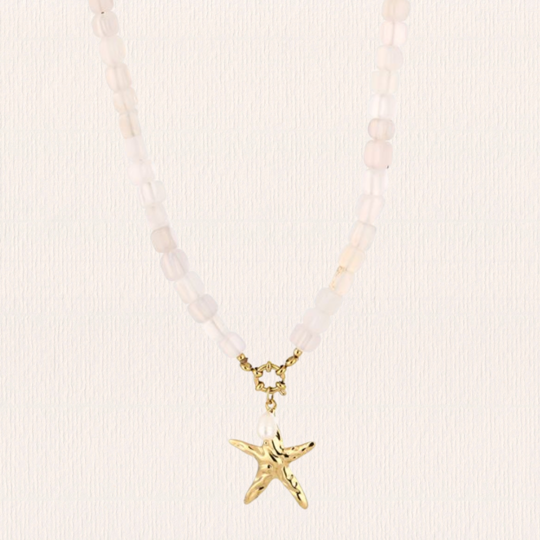 Beige kralenketting met ster bedel