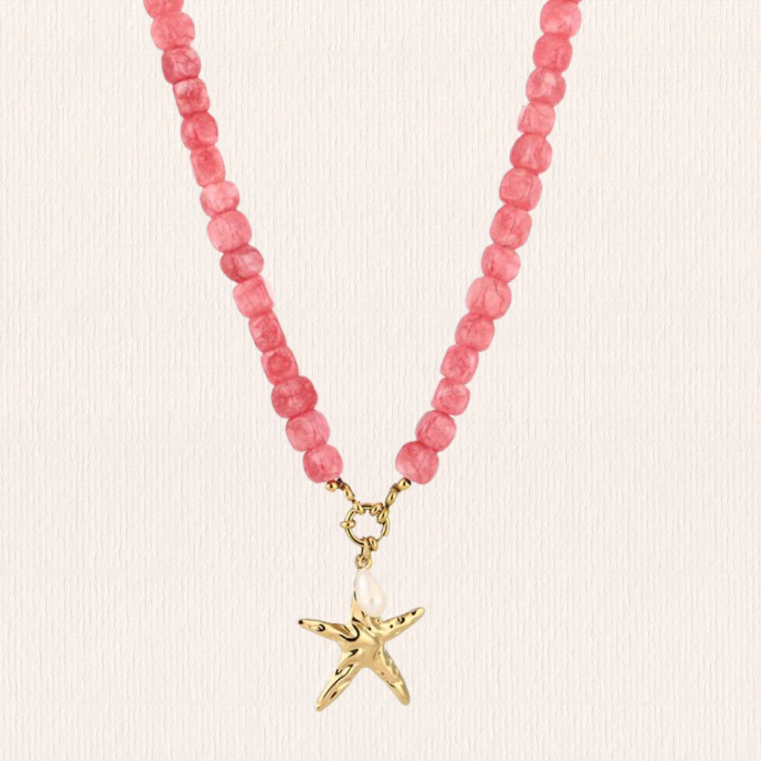 Roze kralenketting met ster bedel