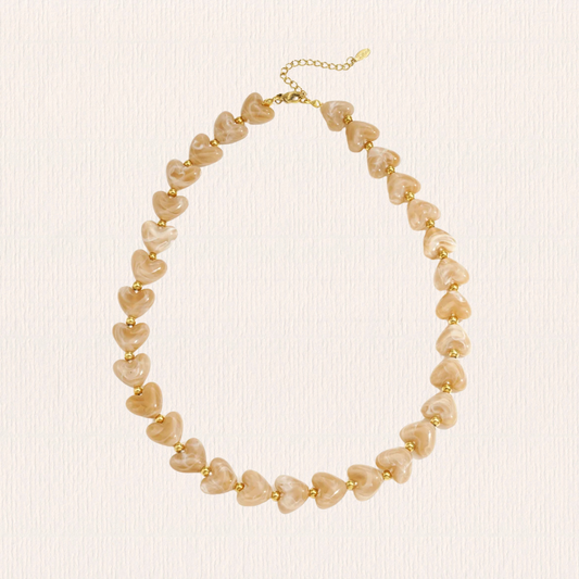 Hartjes ketting beige