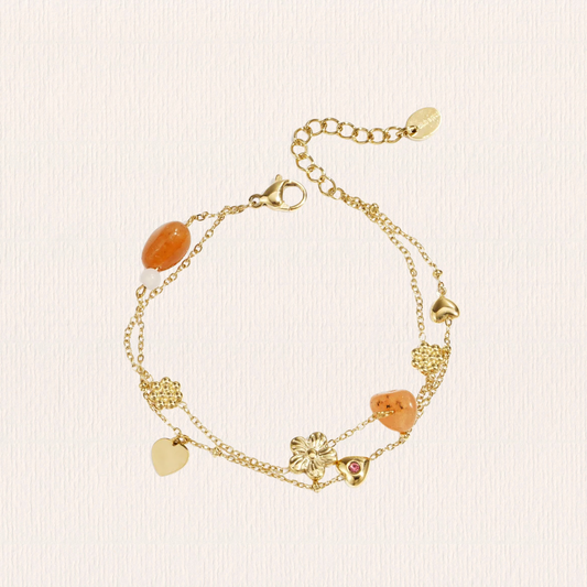 Bedelarmbandje met oranje kralen