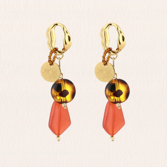 Gouden oorbellen met roze bedeltjes