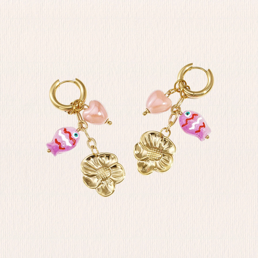 Gouden oorbellen met roze hangertjes