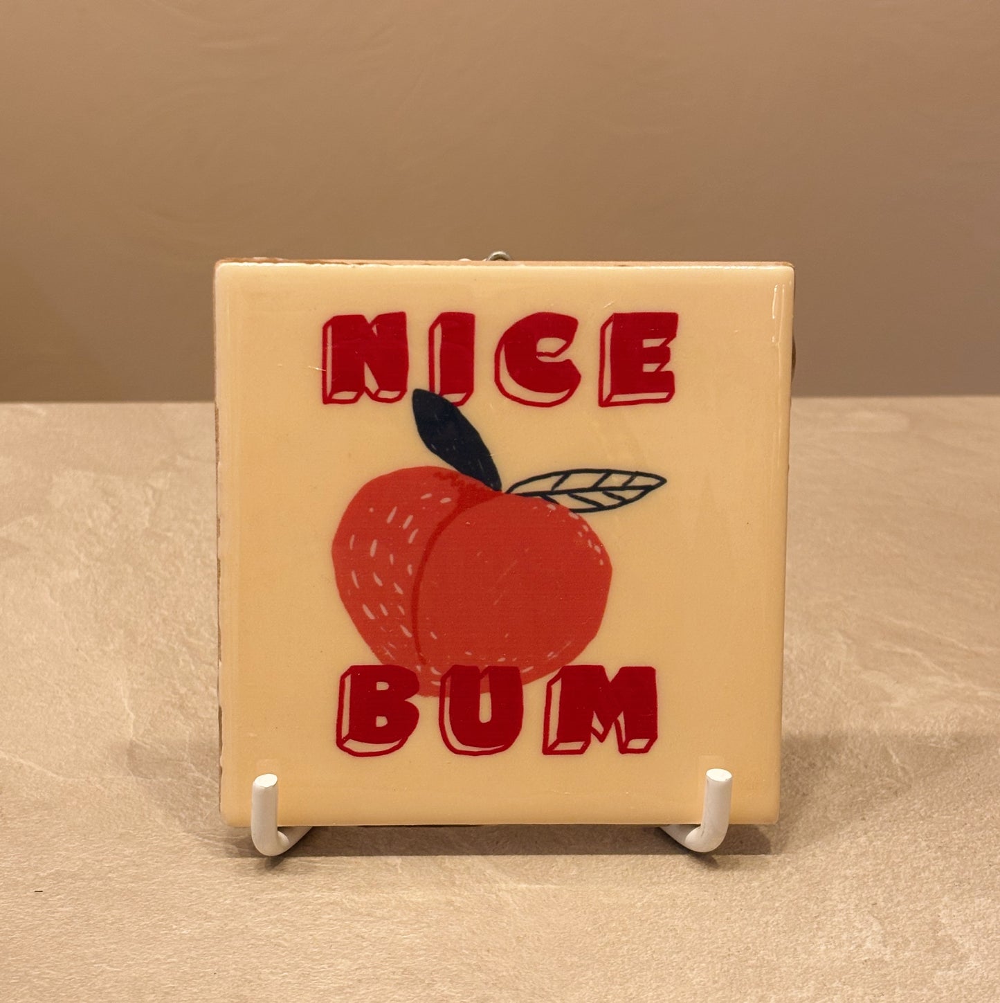 Nice bum tegeltje